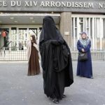 Nayet (C), wearing a Burqa, and Kenza Drider (L), a French Muslim of North African