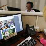 Janet Perez oversees specialists help callers with health insurance, at a customer care center in Providence, Rhode Island
