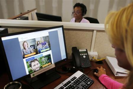 Janet Perez oversees specialists help callers with health insurance, at a customer care center in Providence, Rhode Island