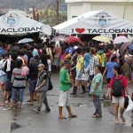 Residents gather to make free calls to their relatives after Typhoon Haiyan devastated Tacloban city, central Philippines