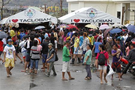 Residents gather to make free calls to their relatives after Typhoon Haiyan devastated Tacloban city, central Philippines