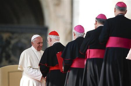 Pope Francis greet cardinals and bishops during the general audience in Saint Peter's Square at the Vatican