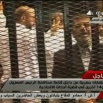 Video still shows ousted former Egyptian President Mursi in a courthouse on the first day of his trial, in Cairo
