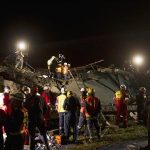 Emergency workers search for survivors after a building collapsed in Tongaat