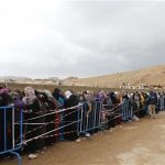 Syrians, fleeing the violence from the Syrian town of Qara, queue to register to get help from relief agencies at the Lebanese border town of Arsal, in the eastern Bekaa Valley