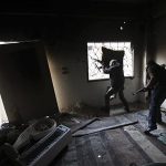 Free Syrian army fighters take up position with their weapons in the Mouazafeen neighbourhood in Deir al-Zor, eastern Syria