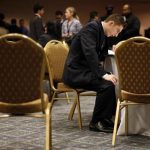 Job seeker fills out forms at career fair in New York City