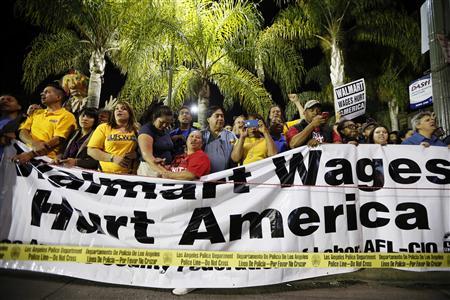 People take part in a protest for better wages outside Wal-mart in Los Angeles
