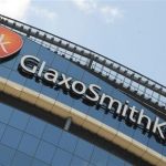 Signage is pictured on the company headquarters of GlaxoSmithKline in west London