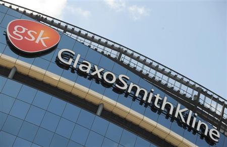 Signage is pictured on the company headquarters of GlaxoSmithKline in west London
