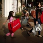 People shop at The Grove mall in Los Angeles