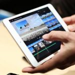 A member of the media holds the new iPad mini with Retnia display during an Apple event in San Francisco