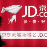 File photo of a woman walking past a advertisement board of Jingdong Mall in Nanjing