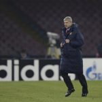 Arsenal's Coach Wenger leaves the pich at the half-time of the the Champions League soccer match against Naples at San Paolo stadium in Naples