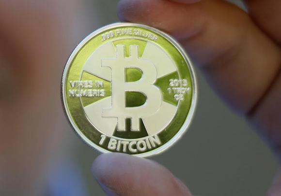 Some of Bitcoin enthusiast Mike Caldwell's coins in this photo illustration at his office in Sandy, Utah