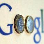 An illustration picture shows a Google logo with two one Euro coins