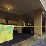 A Hezbollah flag is seen near the crime scene where commander Hasan al-Laqqis was killed in the southern Hadath district in Beirut