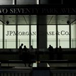 People walk inside JP Morgan headquarters in New York