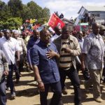 Democratic Republic of Congo's President Kabila walks along a street in Bunagana