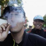 People participate in so-called "Last demonstration with illegal marijuana" on their way to Congress building in Montevideo