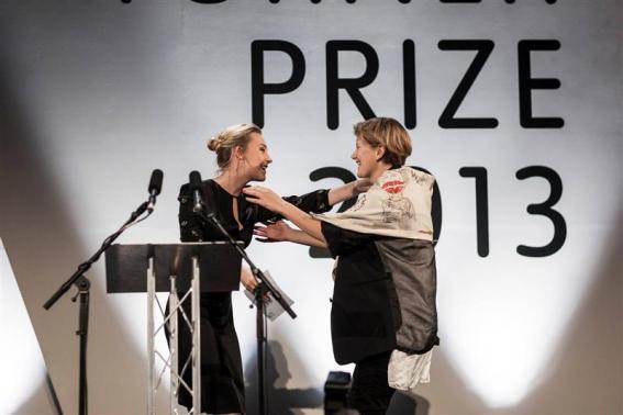 French-born film installation artist Laure Prouvost embraces Irish actress Saoirse Ronan after Ronan awarded Prouvost with this year's Turner Prize, in Londonderry, Northern Ireland