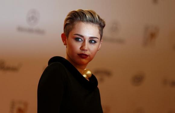 U.S. singer singer Cyrus arrives on red carpet for Bambi 2013 media awards ceremony in Berlin