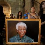 People attend a special Sunday service dedicated to Nelson Mandela at St. George's Cathedral in Cape Town