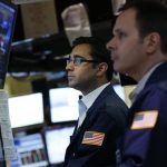 Traders work on the floor of the New York Stock Exchange