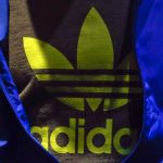 The Adidas logo is pictured on a shirt during the company's annual news conference in Herzogenaurach