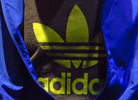 The Adidas logo is pictured on a shirt during the company's annual news conference in Herzogenaurach