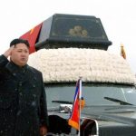 North Korea's new leader Kim Jong-un and his uncle Jang Song-thaek accompany the hearse carrying the coffin of late North Korean leader Kim Jong-il during his funeral procession in Pyongyang