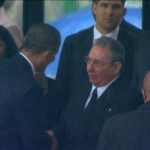 U.S. President Obama shakes hands with Cuban President Castro during Nelson Mandela's national memorial service in Johannesburg