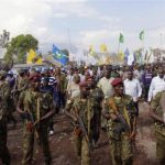 Soldiers clear the way for Democratic Republic of Congo's President Kabila as he makes his way through a street in Goma