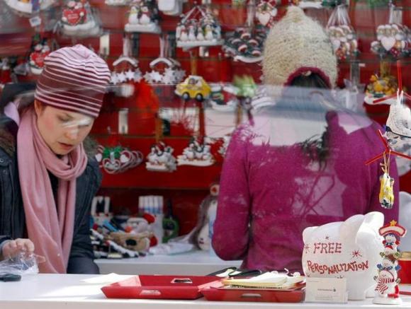 A free personalization promotion is seen inside a holiday-themed store in New York's