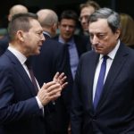 Greece's Finance Minister Stournaras talks to ECB President Draghi during a eurozone finance ministers meeting in Brussels
