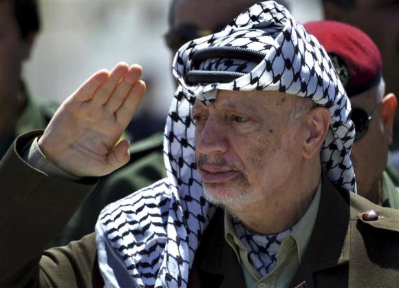 File photo of Arafat reviewing an honour guard on his arrival at the Gaza Strip