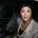 Prime Minister Yingluck Shinawatra leaves Army Club where she held a cabinet meeting in Bangkok