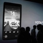 People attend a presentation ceremony for the YotaPhone smartphone in Moscow
