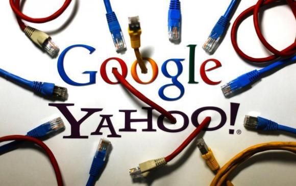 An illustration picture shows logos of Google and Yahoo connected with LAN cables in Berlin