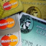American Express and MasterCard credit cards are shown in Washington