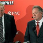 Bobby Petrino, right, D. James R. Ramsey