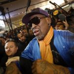 Dennis Rodman is surrounded by journalists upon his arrival from North Korea's Pyongyang at Beijing Capital International Airport