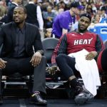 Dwyane Wade, left, LeBron James