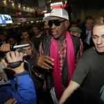 Former NBA basketball player Rodman is surrounded by journalists as he arrives at the Beijing Capital International Airport to leave for Pyongyang, in Beijing