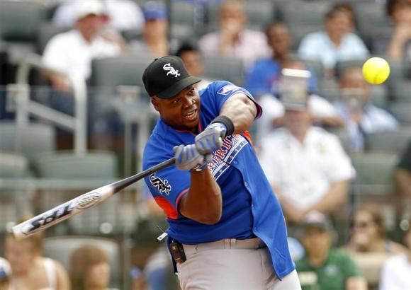 File photo of former MLB player Thomas hits a home run during the Legends and Celebrities All-Star softball game at Citi Field in New York