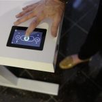 Jennifer McNally, a head of marketing at Stir, demonstrates on the Kinetic Desk at the International Consumer Electronics Show