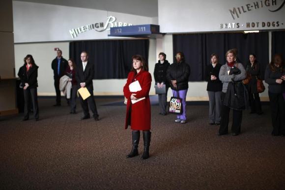 Job seekers listen to a presentation at the Colorado Hospital Association health care career fair in Denver
