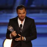 Leonardo DiCaprio accepts the award for best actor in a comedy for "The Wolf of Wall Street" during the 19th annual Critics' Choice Movie Awards in Santa Monica