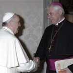 Pope Francis, left, meets with Bishop Gerhard Ludwig Mueller