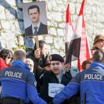 Protesters supporting President Bashar al-Assad of Syria